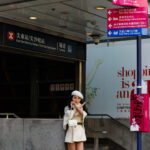 Asian model - Streetsign - Tsim Sha Tsui - Hong Kong